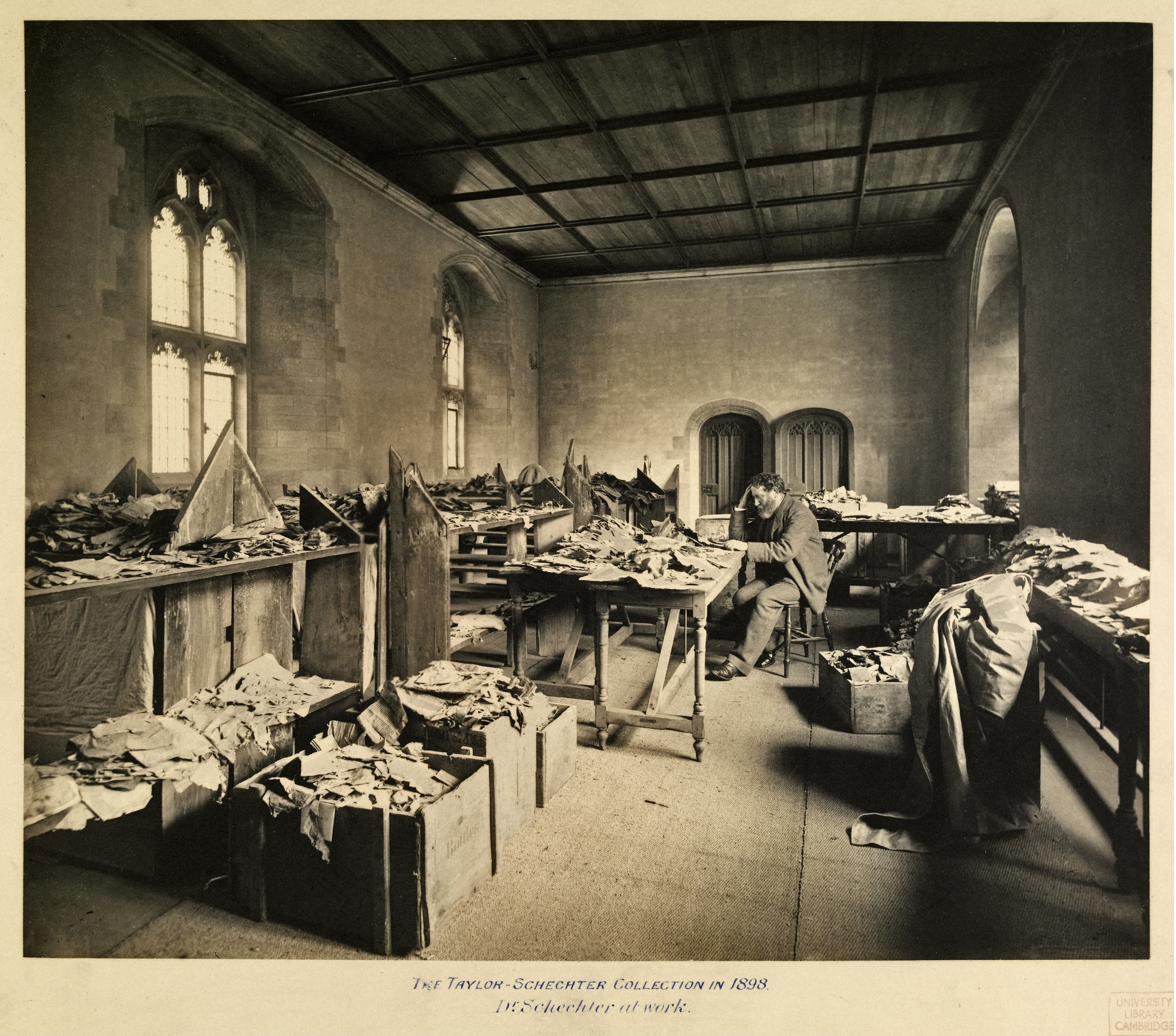 Solomon Schechter at his desk studying Cairo Geniza fragments